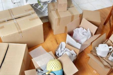 Moving boxes in new house. New apartment background.